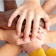 photo of children’s hands joined together