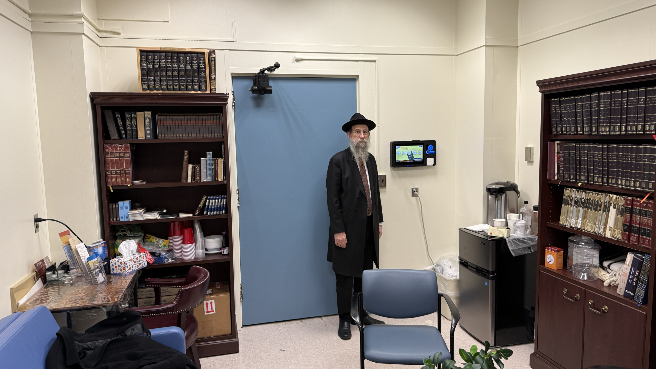 iChessed Donation tablet on a table stand at Chabad SUNY University, allowing visitors and students to give easily and securely to support community programs and events